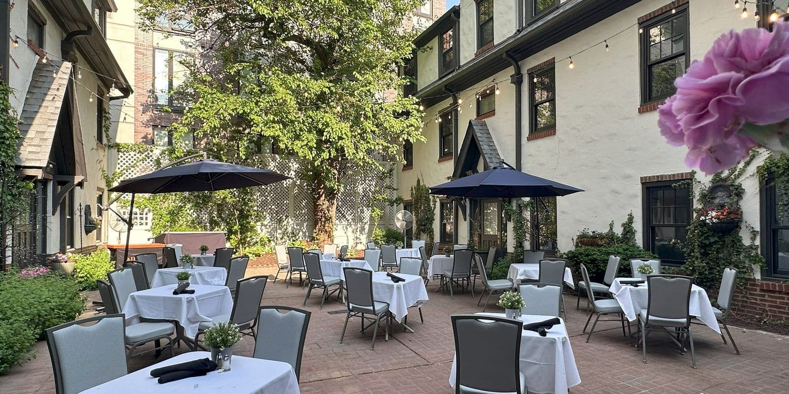 The courtyard in springtime with umbrellas and flowers