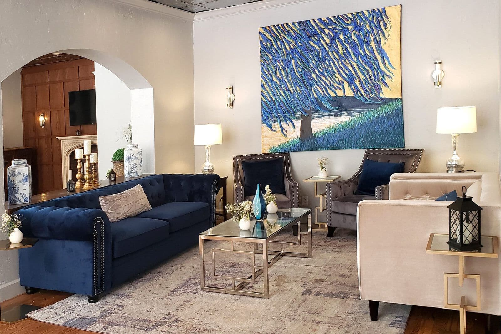 The lobby lounge with navy sofas and a blue painting