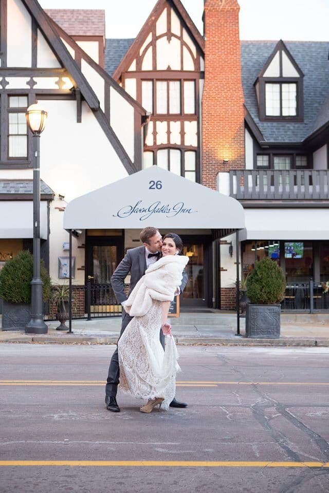 A couple in front of Seven Gables Inn on N. Meramec Ave.